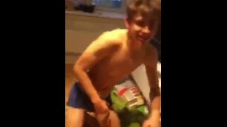 Sexy stud stripping off his clothes. And getting wet!!