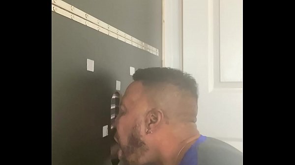 Sucking black dick at my home glory hole