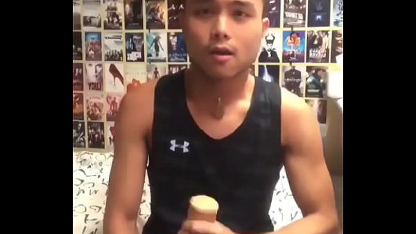 Asian boy jerking with new toy